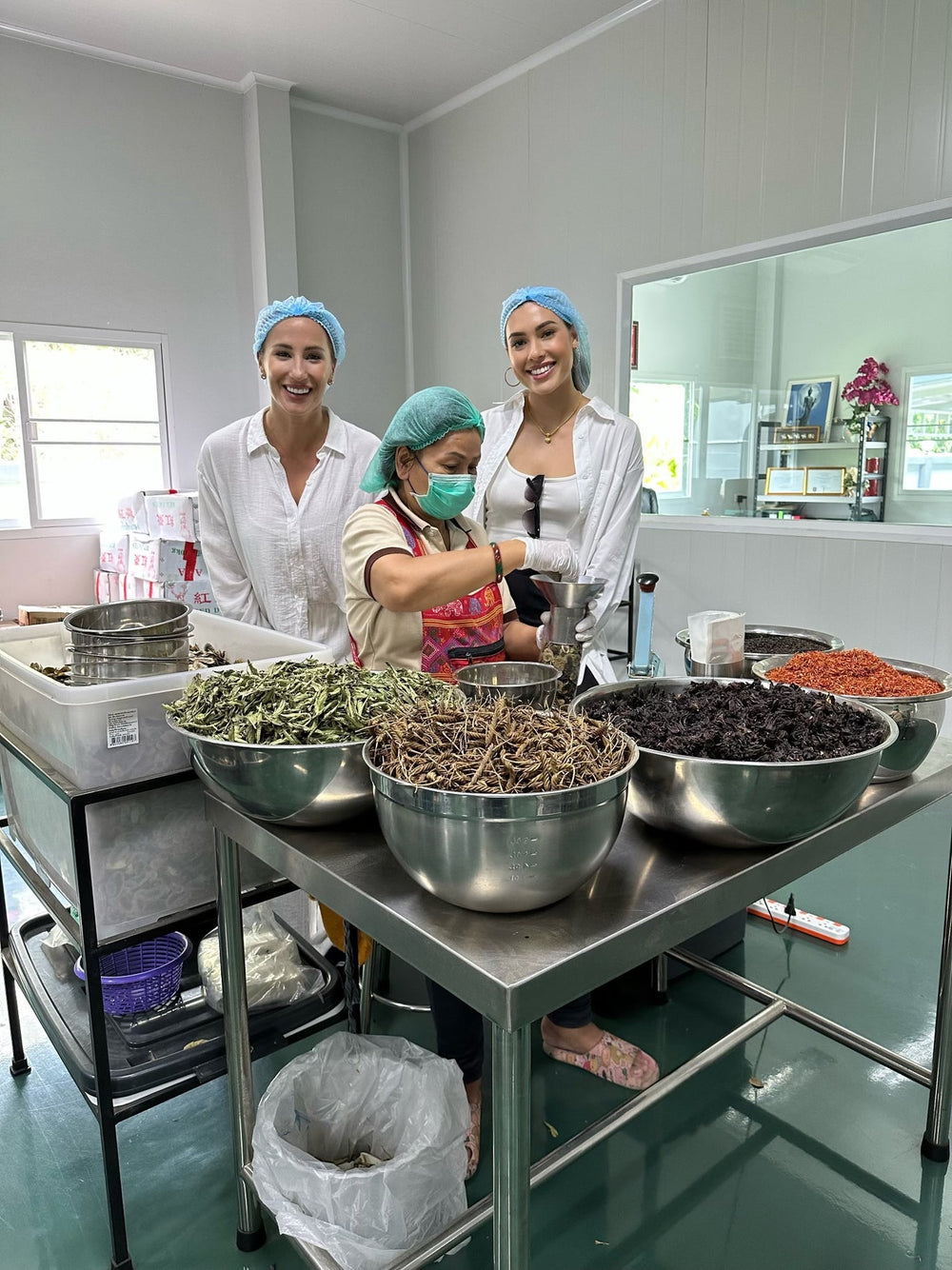 Jayne and Quincy at the blending facility outside Bangkok